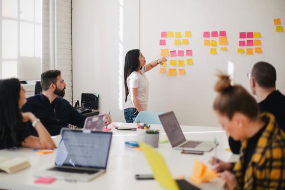 A group of people brainstorming ideas in a meeting room 