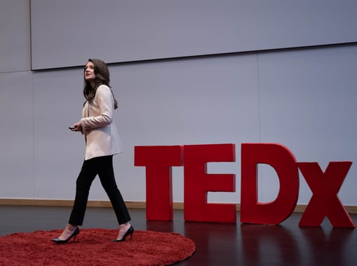 Author and brand strategist, Paige Velasquez Budde Speaking at a TEDX Conference